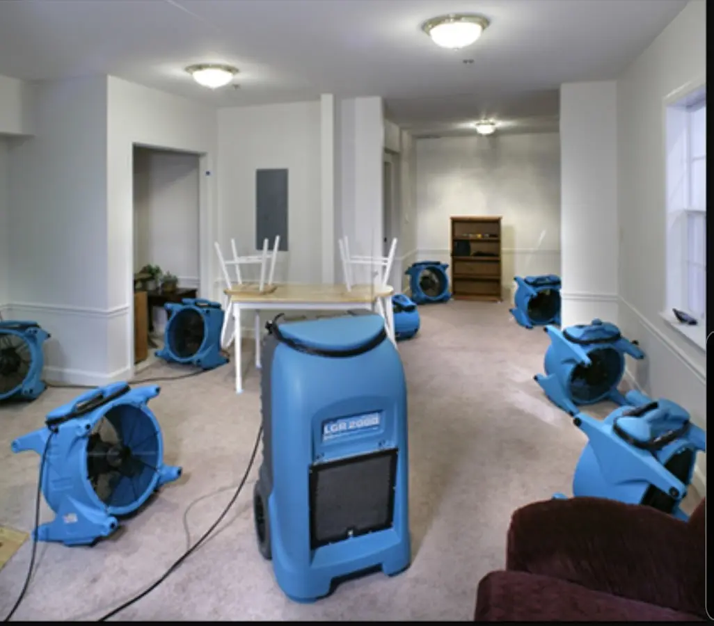 Air movers and dehumidifier setup for Water Damage Restoration in Homeland